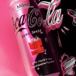 coca-cola-move-can-on-pink-and-black-background.