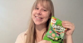 girl-holding-green-bag-of-skittles.